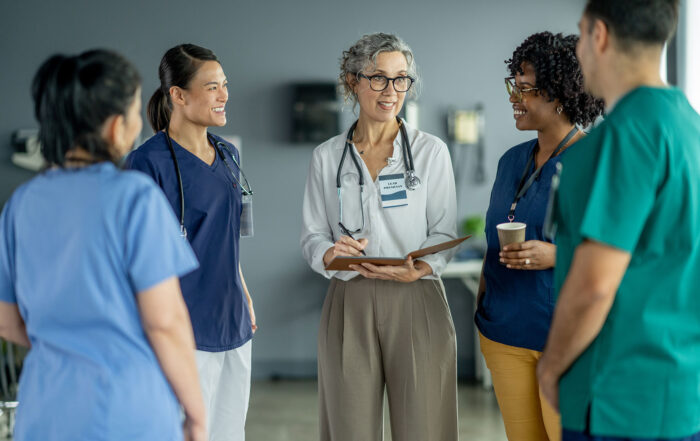 Group of medical professionals talking, Minnesota DHS disqualification for criminal conviction